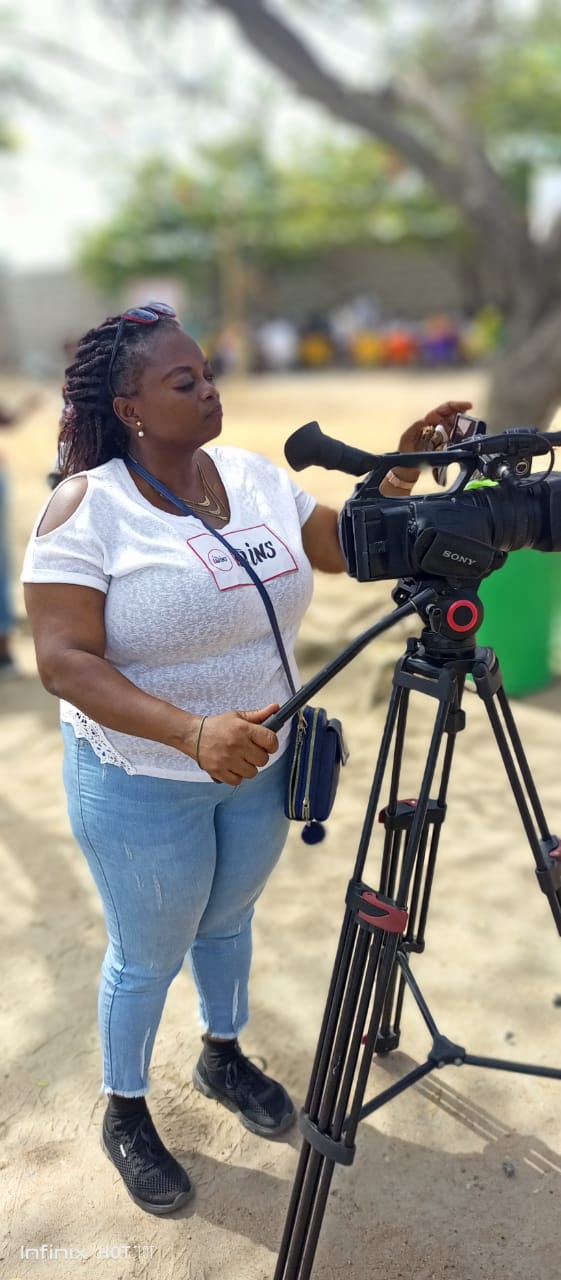 Tutor operating a Sony broadcast camera during outdoor training